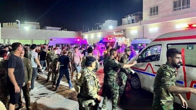 100 killed in fire during wedding hall in Iraq
