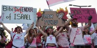 Waving flags, tens of thousands rally against Israeli govt
