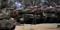 Israeli tanks advance into areas in north and south Gaza, fighting rages