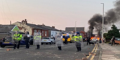 Riots flare in another UK city as police brace for weekend turmoil