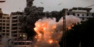 Israel pounds Beirut suburbs, 31 killed
