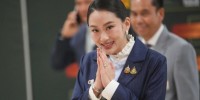 Thai PM overcomes rivals' challenge amid father's alleged influence