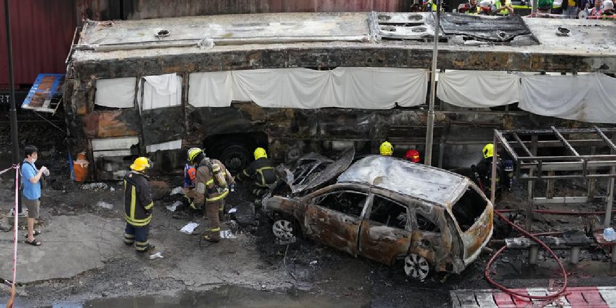 Freight train hits bus in Thailand rail crossing, killing eight people