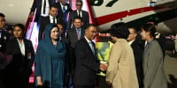 PM arrives in Dalian city of China