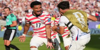 Ten-man United States beat Bosnia 2-0 to reach World Cup round of 16