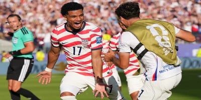 Ten-man United States beat Bosnia 2-0 to reach World Cup round of 16